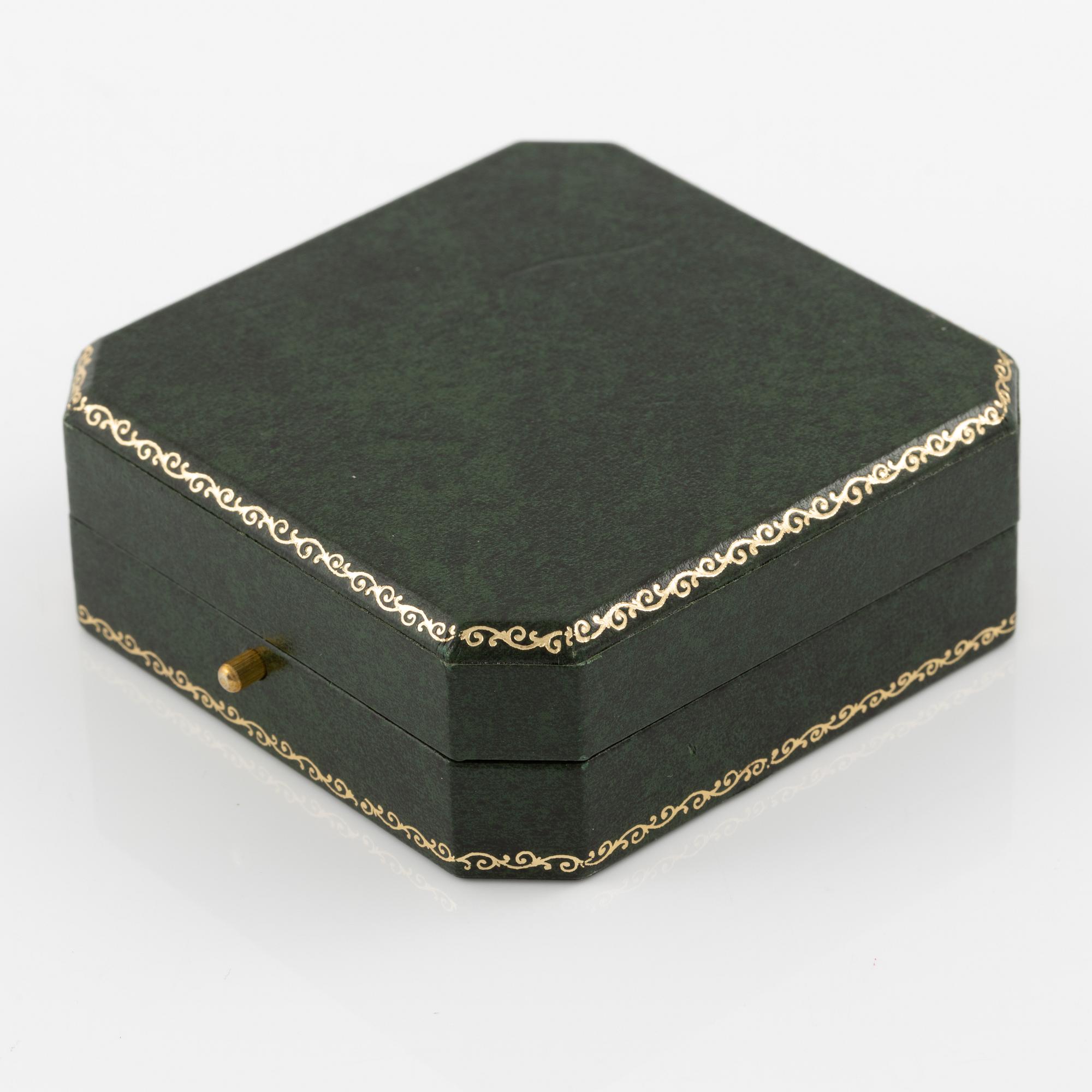 Brooch 18K gold set with round brilliant-cut diamonds as well as emeralds, sapphires, and rubies.