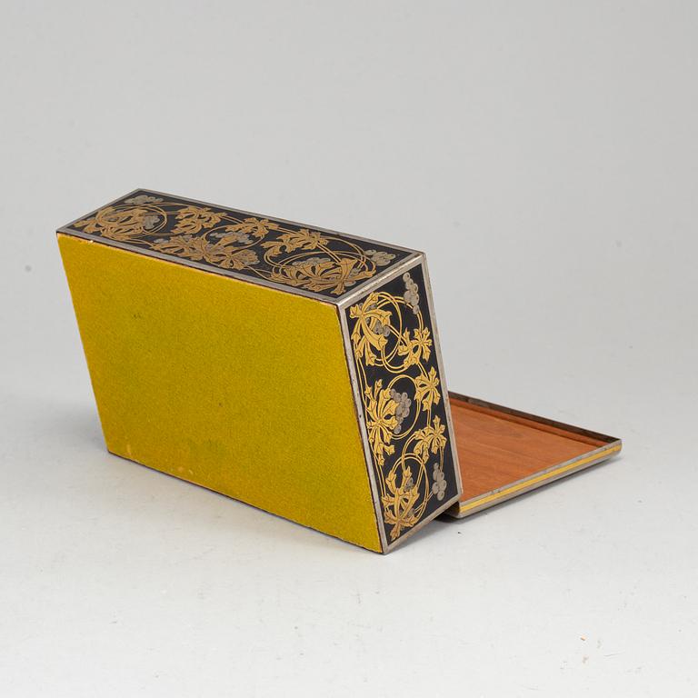 A steel and brass cigarr box by Emil Olsson Eskilstuna around 1900.