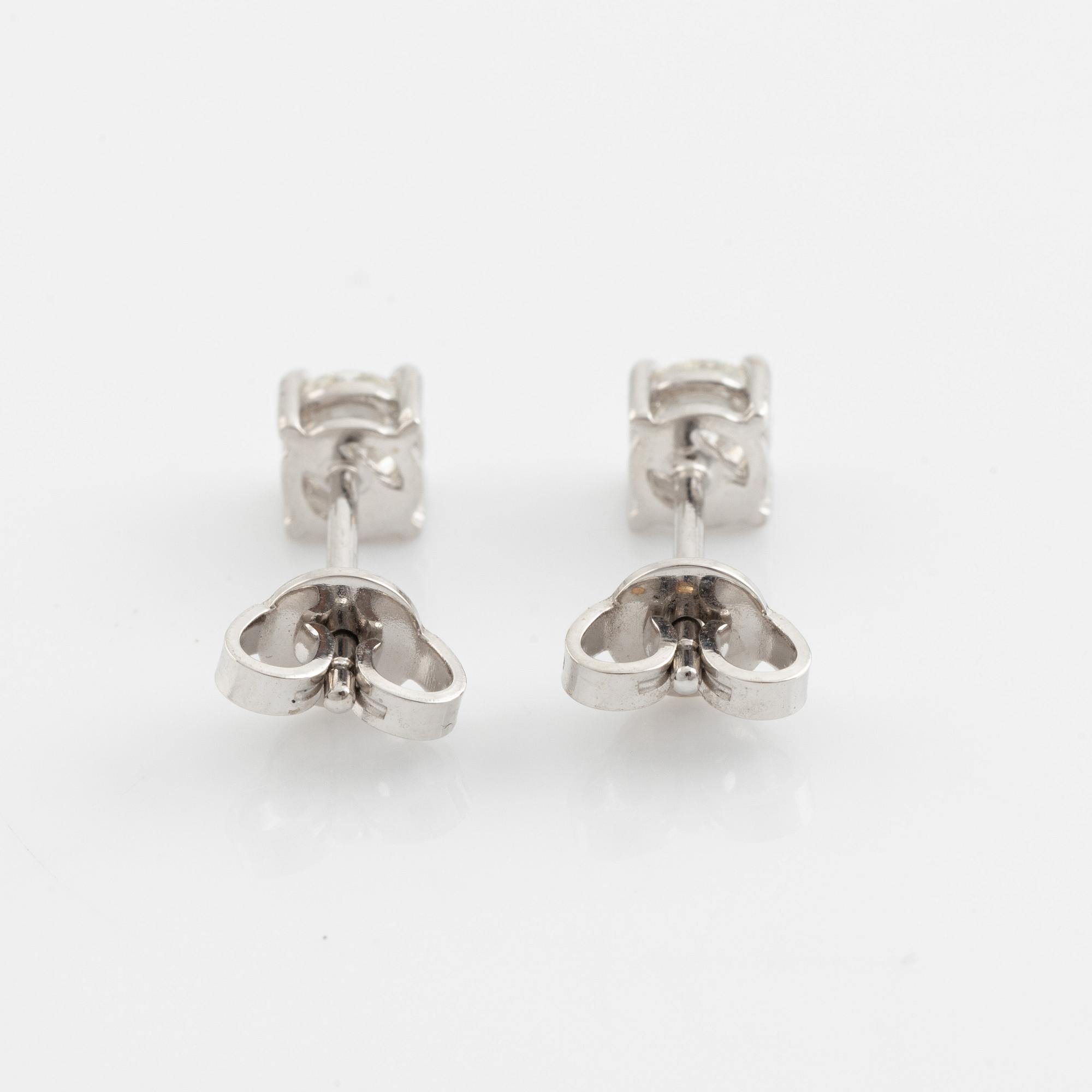 Brilliant cut diamond stud earrings.