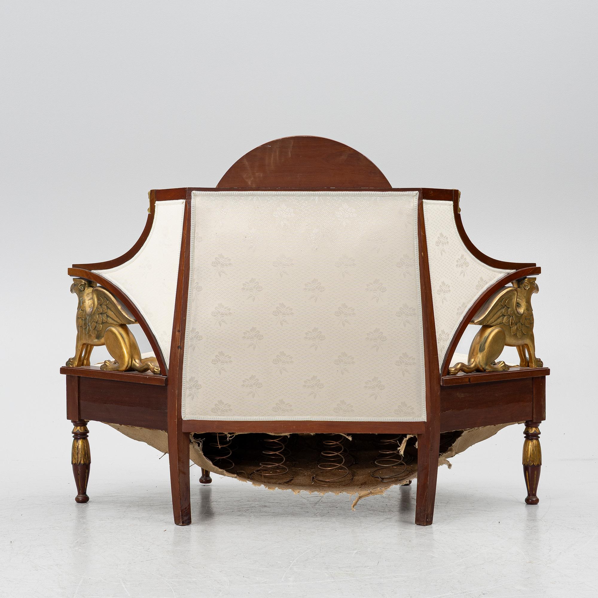 An Empire-style sofa, around 1900.
