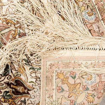 An Oriental silk carpet ca 91x62 cm.