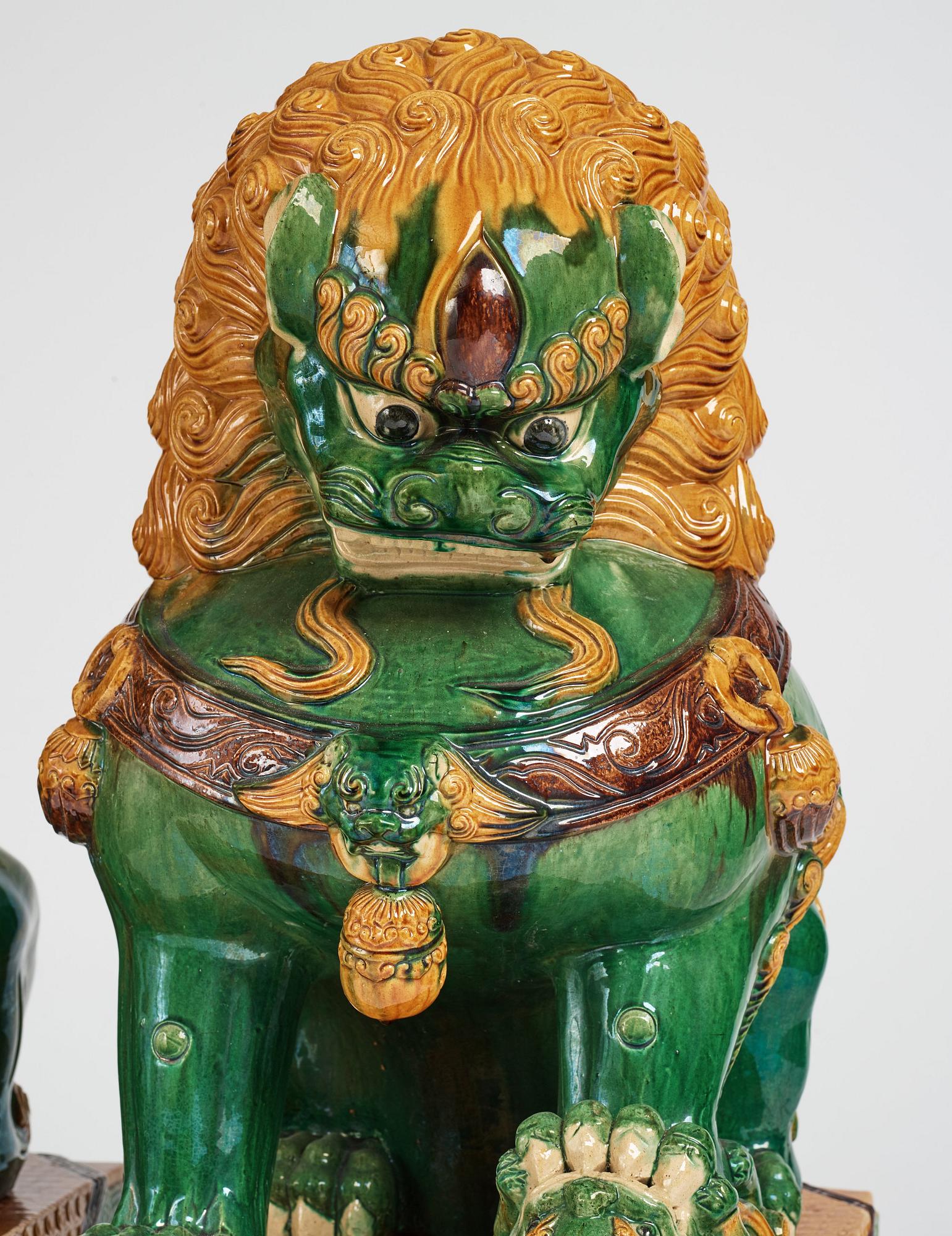 A pair of large buddhist lions, early 20th Century.