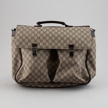 Gucci, a messenger bag.