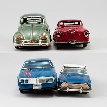 A lot of four tinplate toy cars by Bandai and Marusan, Japan, 1950/60s.