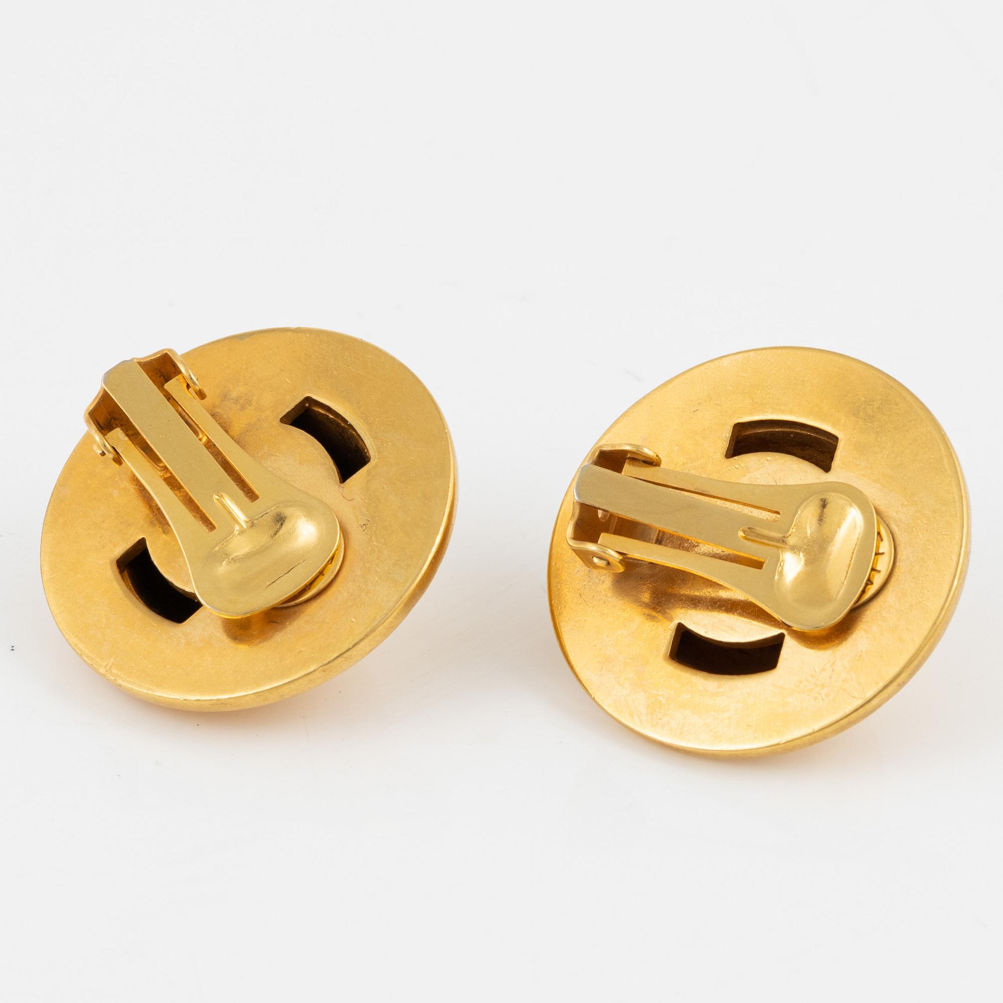 Céline, a pair of clip on earrings.