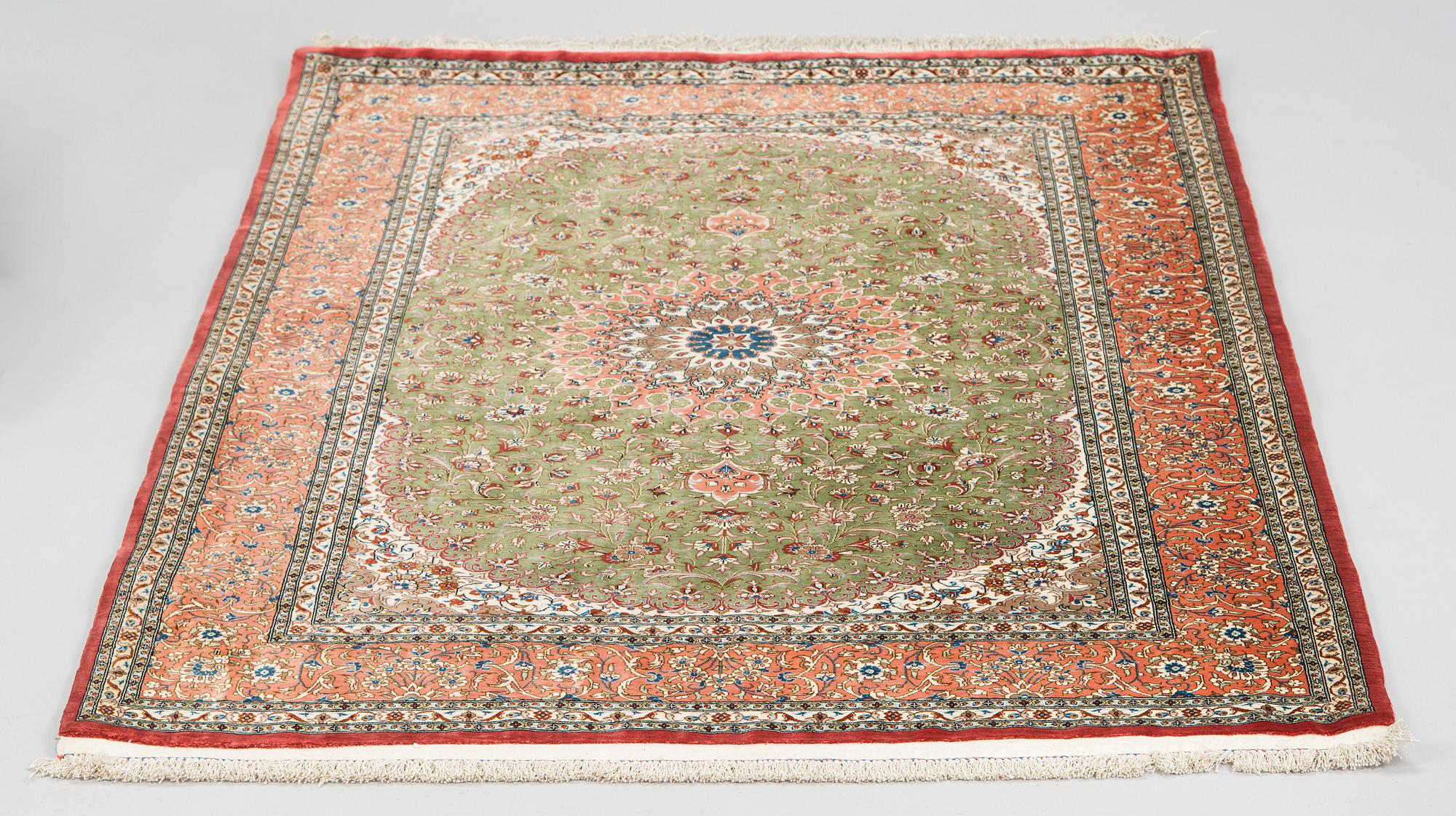 A silk Qum rug, circa 152 x 101 cm.