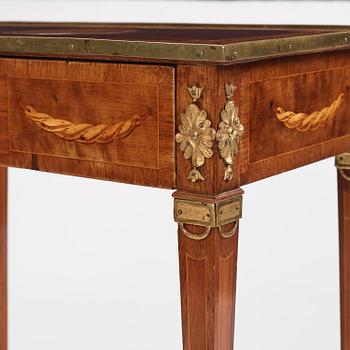 A Gustavian marquetry and gilt brass-mounted table by G. Iwersson (master in Stockholm 1778-1813).