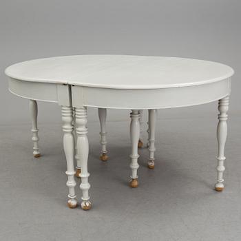 A mid 19th century dining table with six extension leaves.