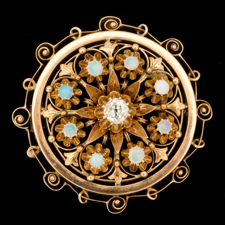 A 0.20 ct old-cut diamond and opal brooch.