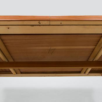A mid-20th century dining table.