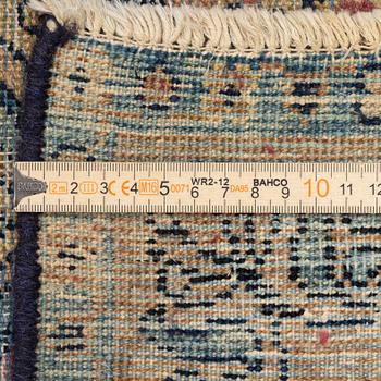 A semi-antique Kerman carpet, c. 325 x 203 cm.