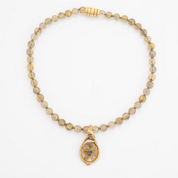 Arne Blomberg, pendant with chain, rutile quartz, gold and diamonds.