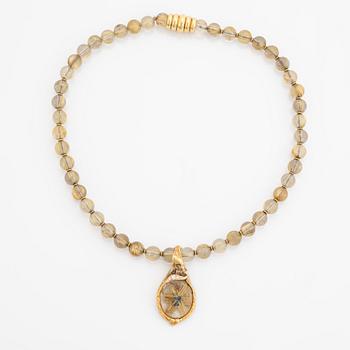 Arne Blomberg, pendant with chain, rutile quartz, gold and diamonds.