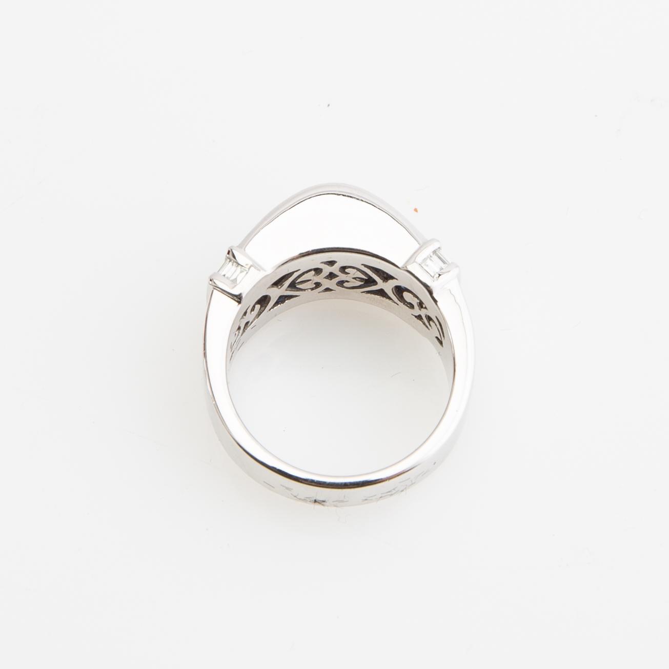 Ring, 18K white gold with baguette-cut diamonds and princess-cut sapphires.