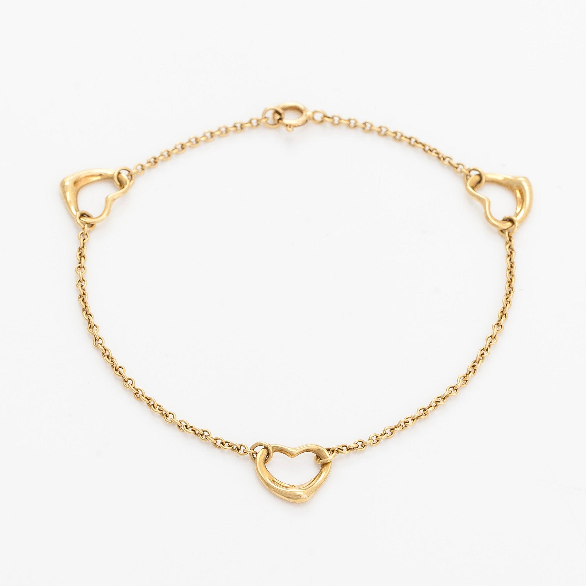 Tiffany & Co, an 18K gold 'Open Heart' bracelet.