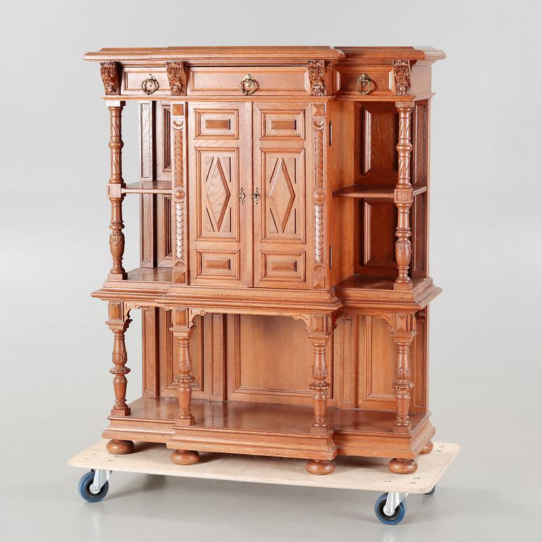 A cabinet in baroque style, made in the first half of the 20th century.