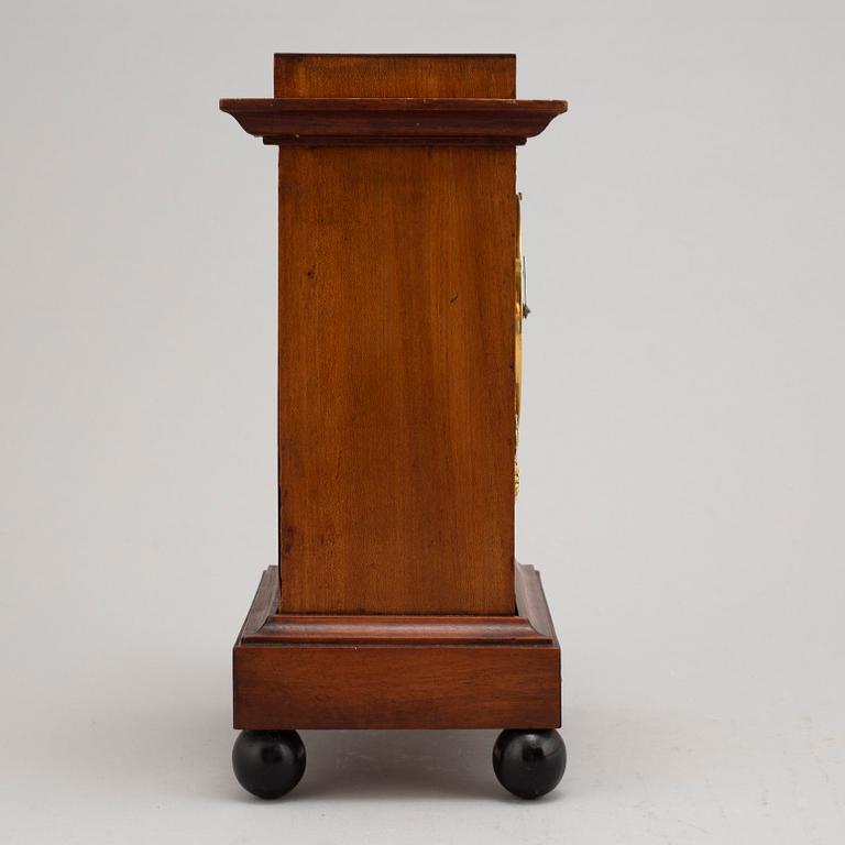 An Empire mantel clock, early 19th Century.