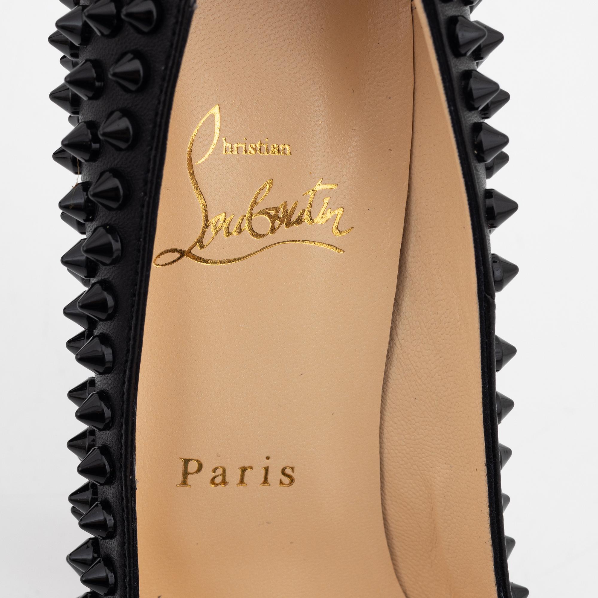 Christian Louboutin, a pair of black leather and studs pumps
