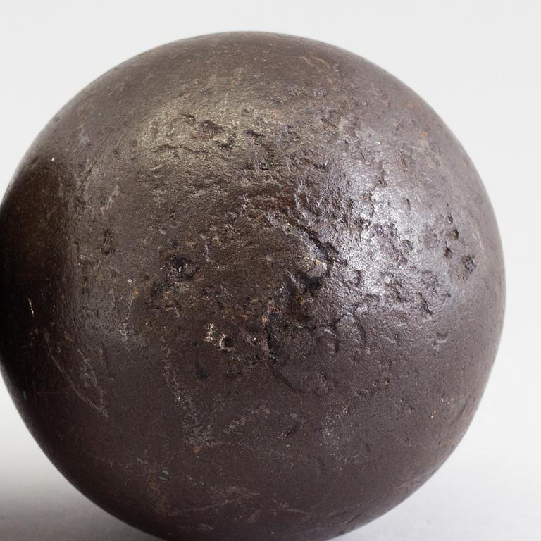 FOUR IRON BULLETS, 18th century.