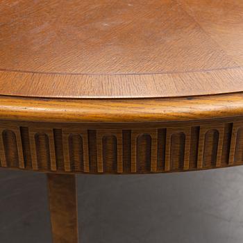 an oak dining table, first half of the 20th century.