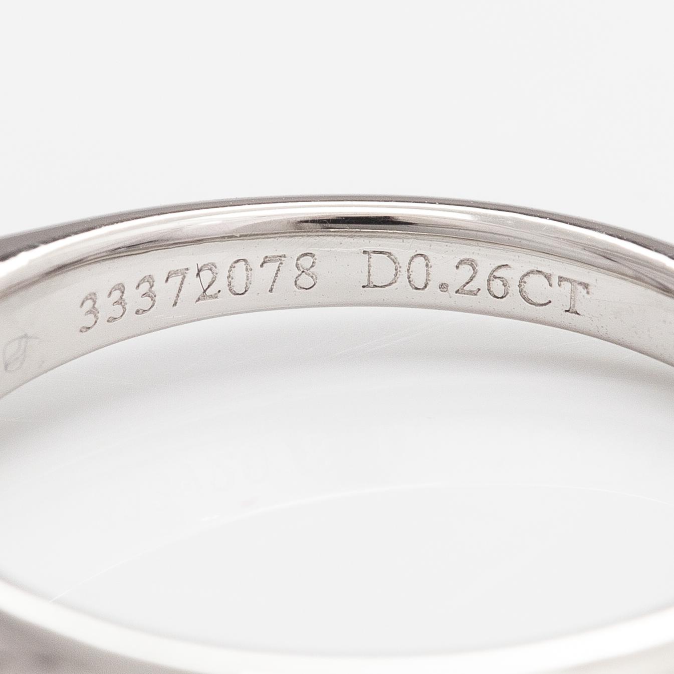 Tiffany & Co, A platinum ring with a ca. 0.26 ct diamond.
