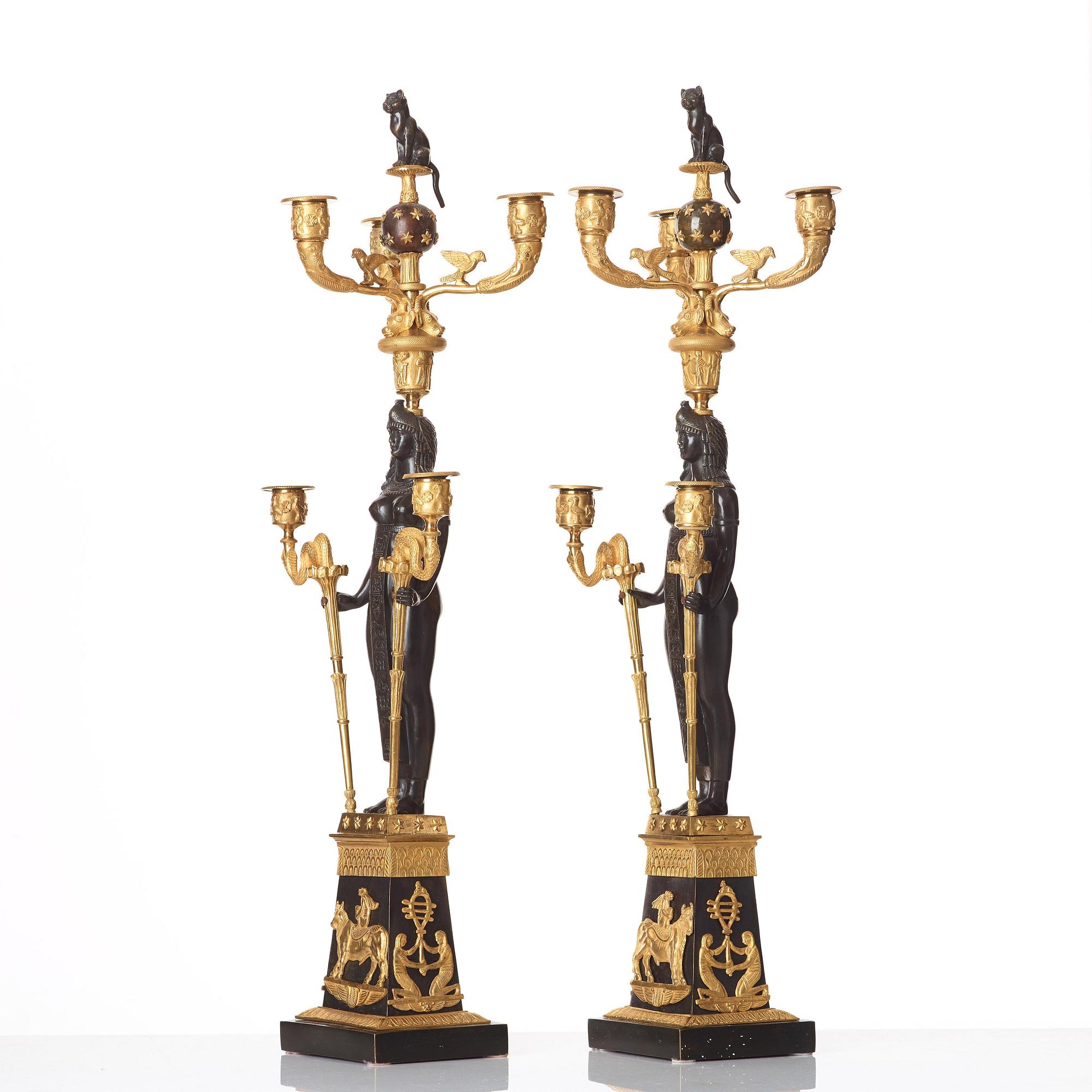 A pair of Russian Retour d'Egypte Empire Alexander I five-light candelabra, St. Petersburg.
