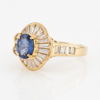 Ring, 18K gold with sapphire and baguette-cut diamonds.