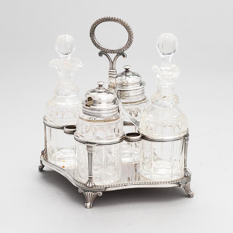 Glass and sterling silver cruet stand, maker's marks of Samuel Hennell and Robert Hennell III, London 1811 and 1879.