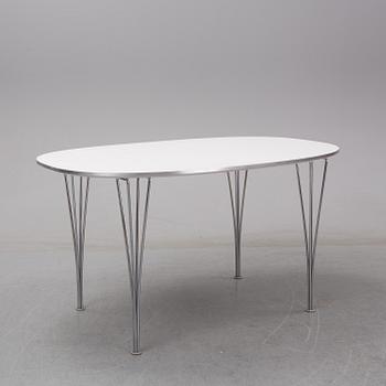 A 'Superelliptic' table by Bruno Mathsson & Piet Hein for Fritz Hansen, dated 2002.