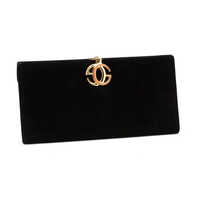 GUCCI, a black suede wallet with red leather lining.