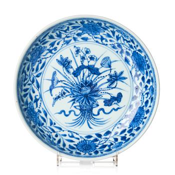 1109. A blue and white 'lotus bouquet' dish, Qing dynasty, 18th century.