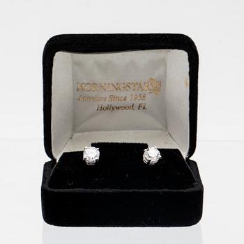 A pair of 14K white gold earrings set with round brilliant-cut diamonds.