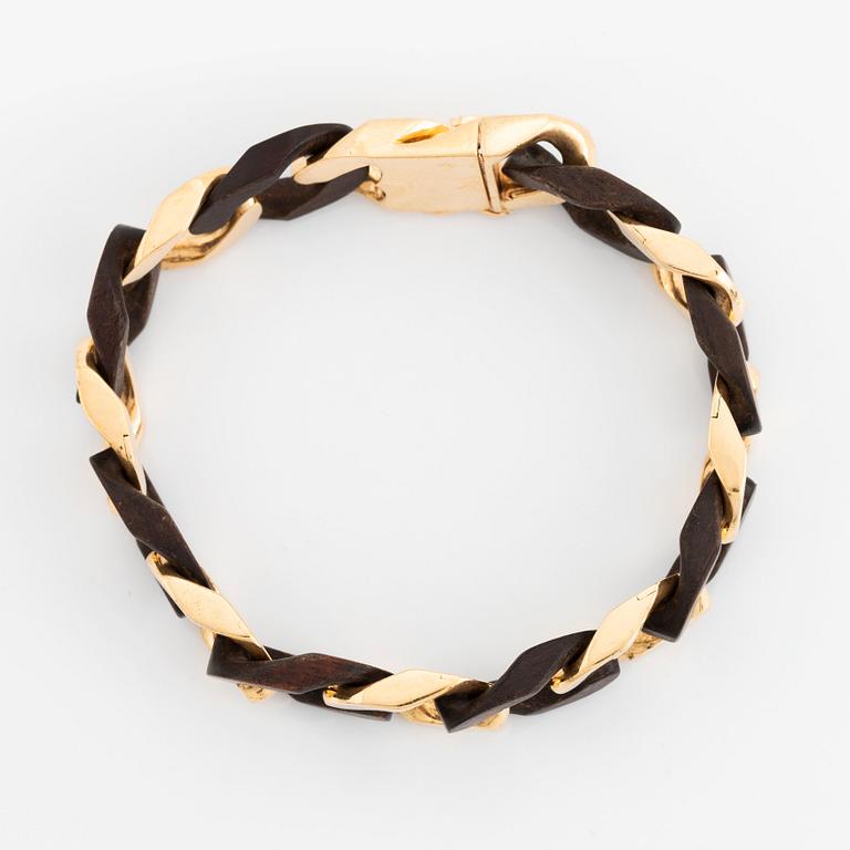 A Van Cleef & Arpels 18K gold and wood bracelet.