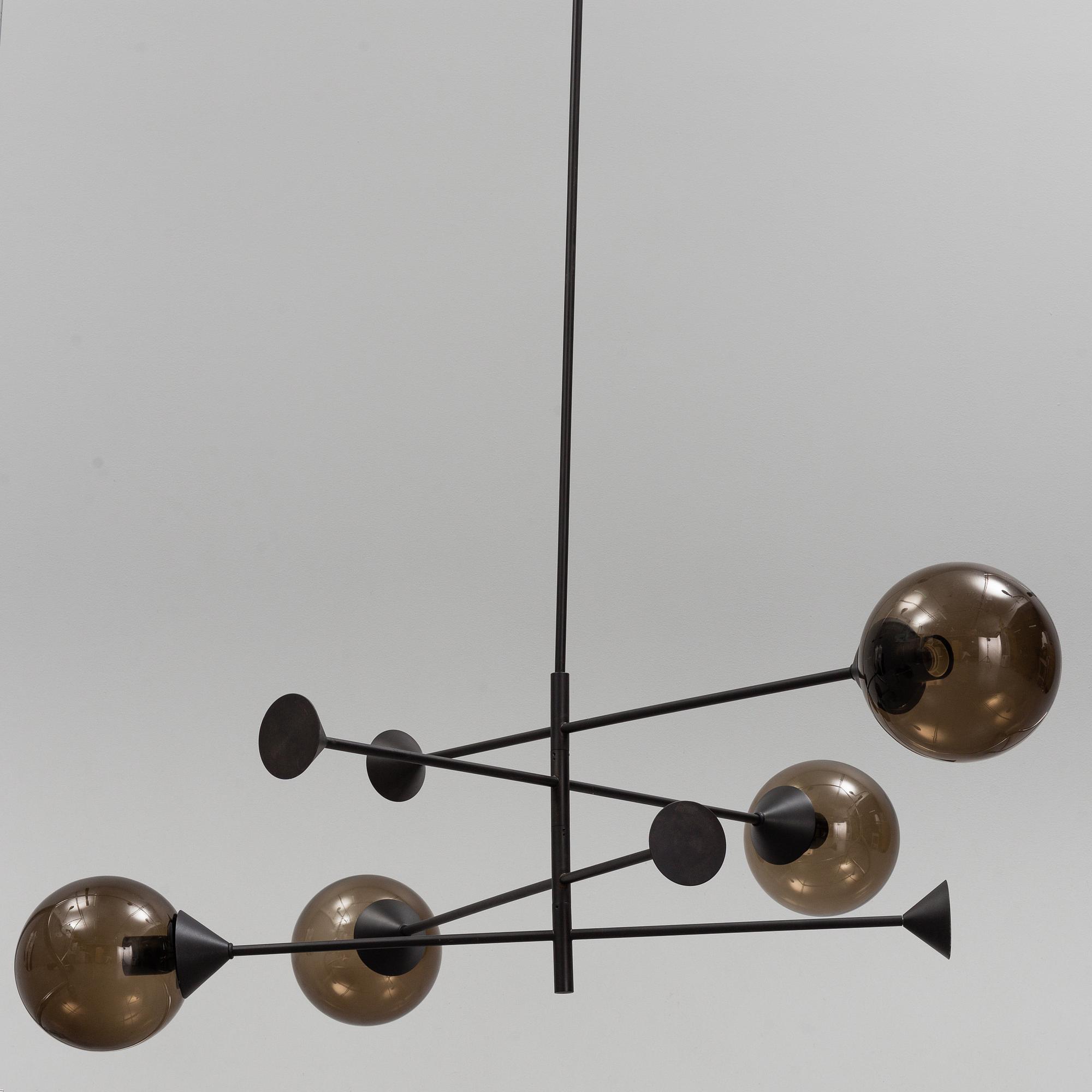 A 21st century "Kendama" LED pendant lamp, design Massimo Zazzeron, Giorgetti.