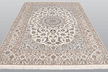 A carpet, Nain part silk s.k 6LAA, ca 310 X 209 cm.