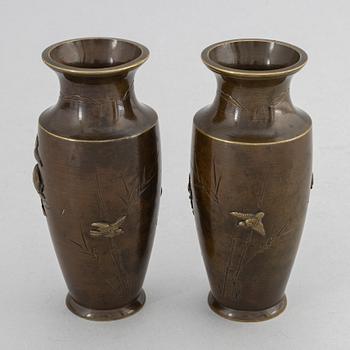 A pair of Japanese patinated bronze and mixed metal vases, Meiji period (1868-1912).