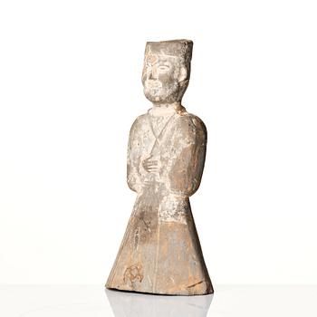 A pottery figure of a standing male figure, Han dynasty (206 BC - 220 AD).