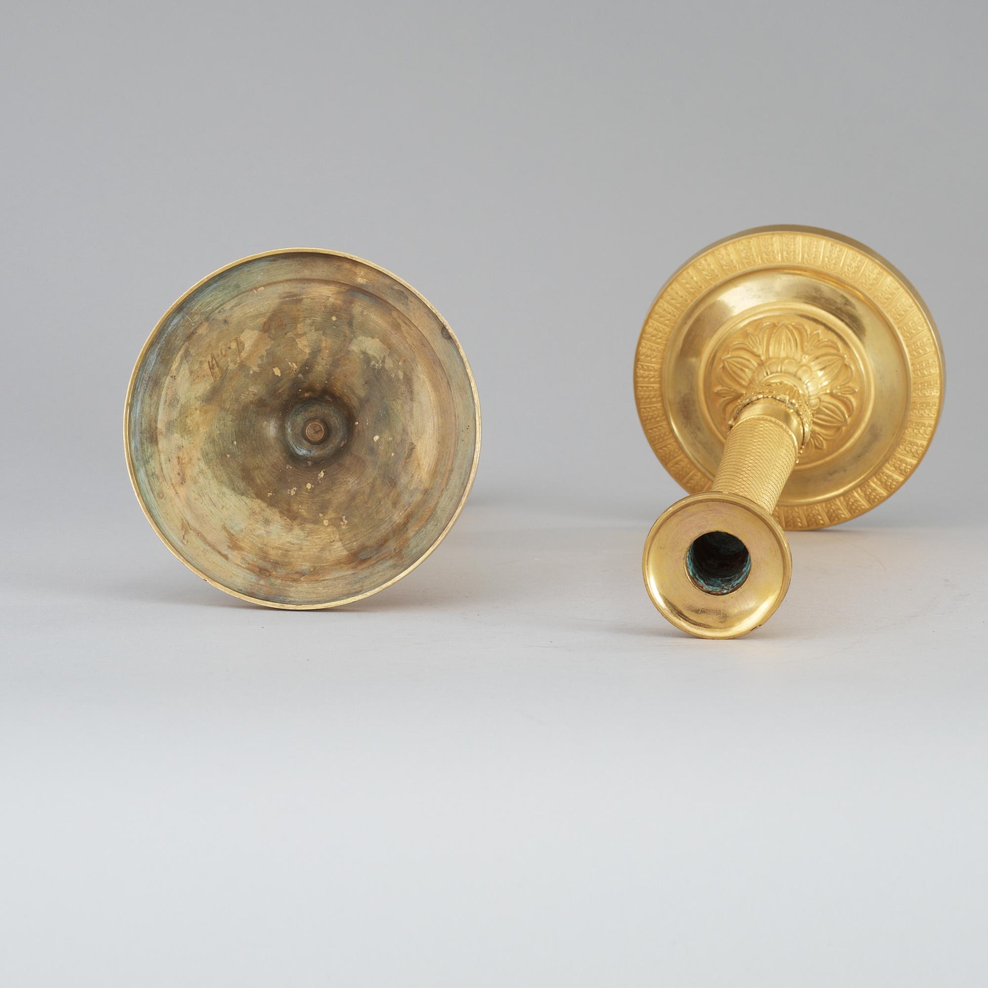 A pair of French Empire early 19th Century candlesticks.