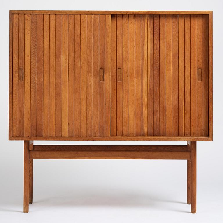 Jørgen Høj, an oak cabinet, Knud Willadsen Møbelsnedkeri, Lillerød, Denmark, 1950s.