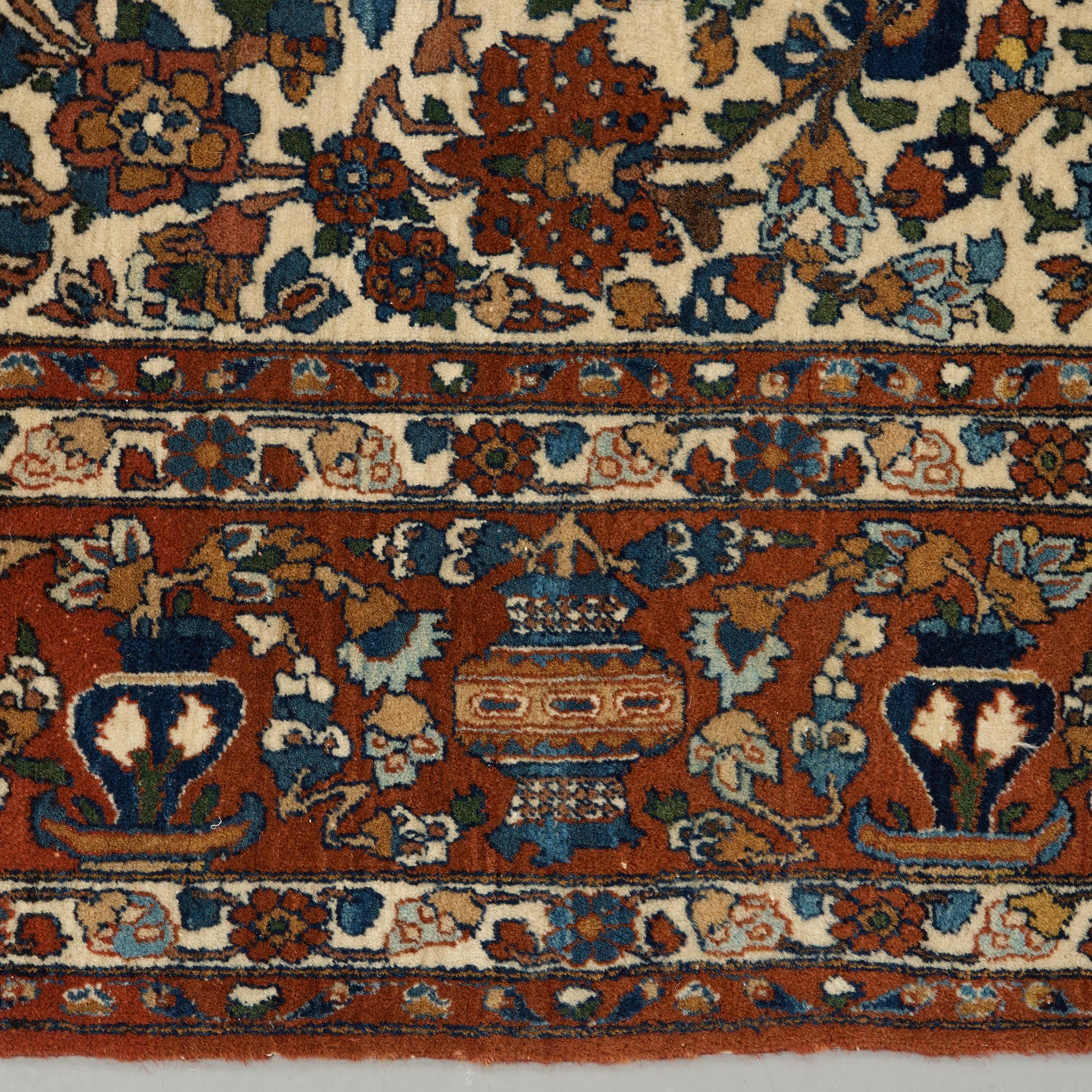 A semi-antique carpet from Esfahan, around 216 x139 cm.
