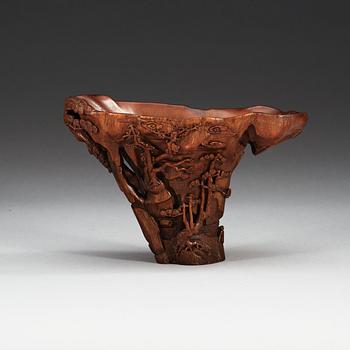 A finely carved rhinoceros libation cup, Qing dynasty, Kangxi (1662-1722).