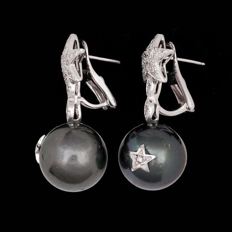 EARRINGS, cultured tahiti pearls, 14,8 mm, and brilliant cut diamonds, tot. app. 0.75 cts.