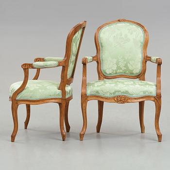 Two matched Louis XV 18th century armchairs.