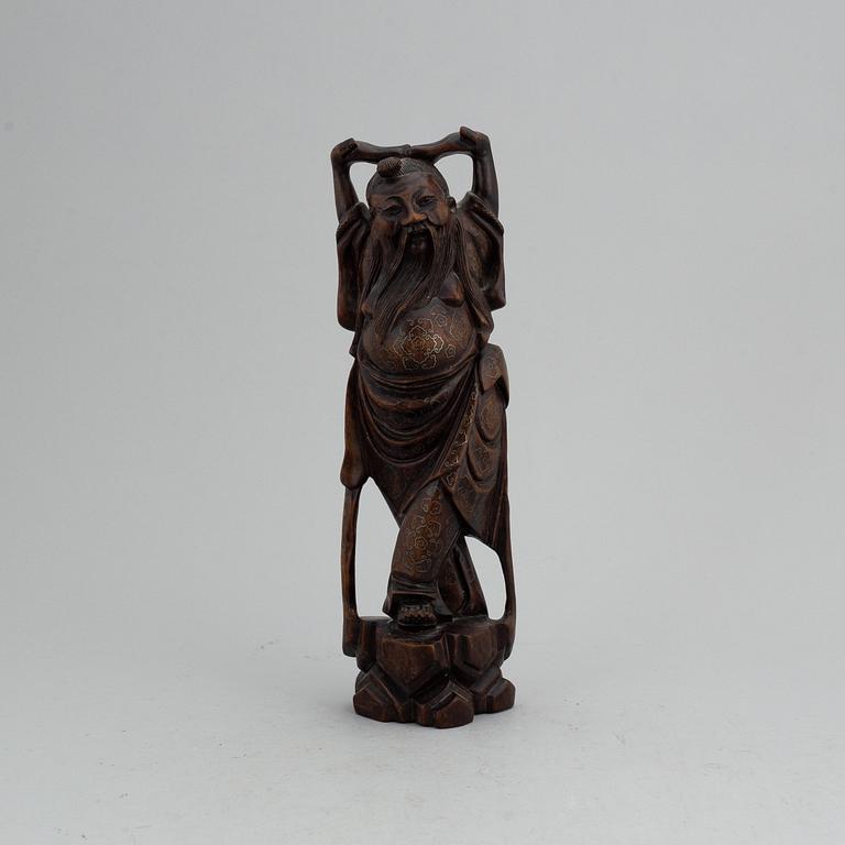 SKULPTUR, trä samt silver inläggningar. Kina, 1900-tal.