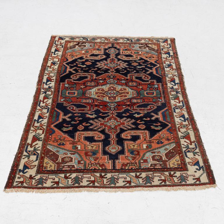 A Heriz rug, c. 192 x 133-139 cm.