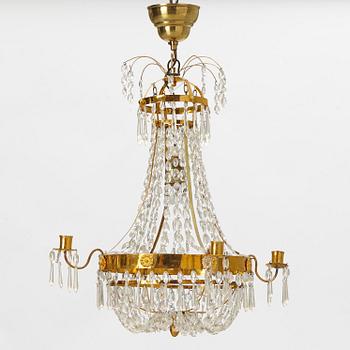 A late Gustavian gilt-brass and cut-glass four-branch chandelier, circa 1800.