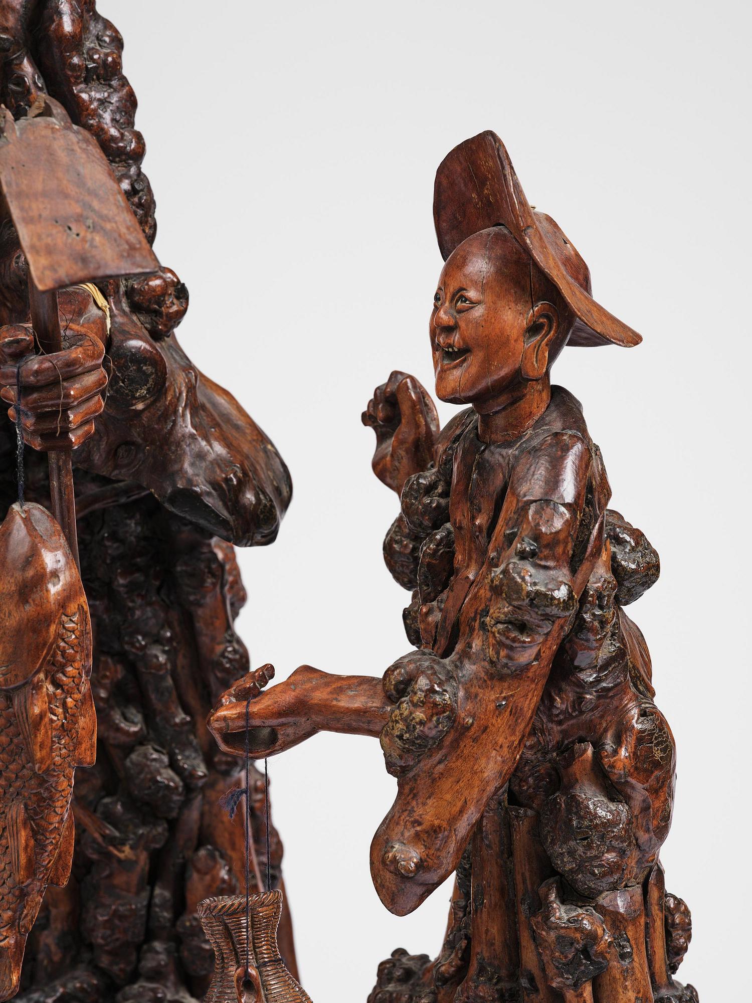 A large well sculptured root sculpture of 'Sholau and attendant', late Qing dynasty, 19th century.