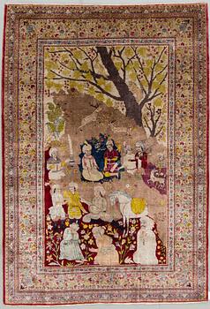 A CARPET, a semi-antique silk Tabriz figural, signed Haddad, 180,5 x 123,5 cm.