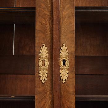 A French Empire mahogany and gilt-bronze mounted bibliothèque, early 19th century.