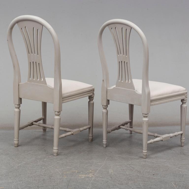 a set of 4+4 gustavian style chairs from the second half of the 20th century.